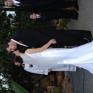 Bride and Groom Share First Kiss at Outdoor Wedding