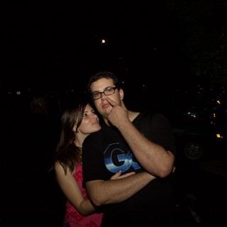 Couple Poses Playfully on a Summer Night Out