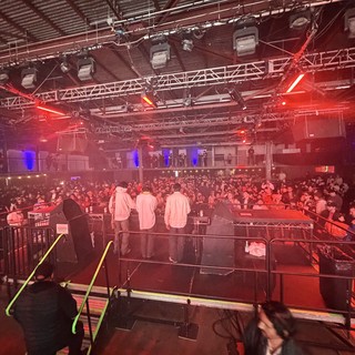 Electronic Music Event: Backstage View of Packed Venue