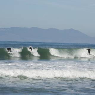 Dynamic Trio Surfing the Pacifica Waves