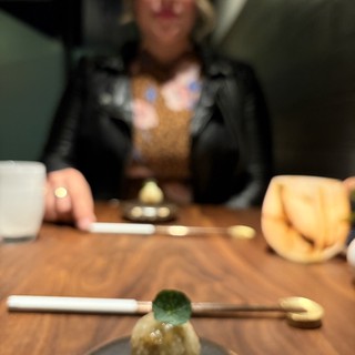 Intimate Dining Moment with Artistic Dessert Presentation