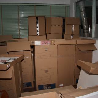 The Stack of 9 Cardboard Boxes