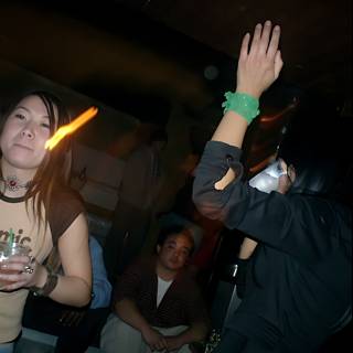 Raising Her Hand in the Night Club