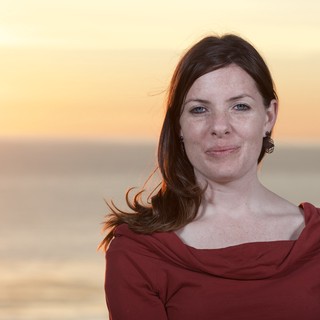 Woman in Red at Golden Hour Ocean Sunset