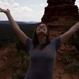 Joyful Woman Celebrates Atop Sedona Red Rock