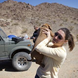 Woman and Dog in the Desert Adventure