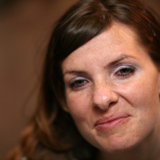 Candid Portrait of a Woman with a Knowing Smirk