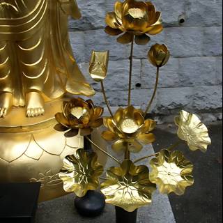 Golden Buddha with Floral Offerings