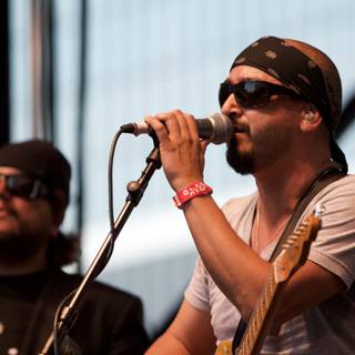 Grand Performance of Ozomatli's 2007 Concert featuring Singer with Bandana and Sunglasses