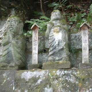 Buddha Statues on a Rock Wall