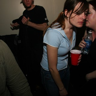Two Women Conversing at New Year's Eve Party