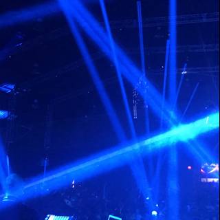 Nightclub Rock Concert with DJ and Blue Lighting