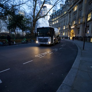 White Cement Truck on London Street at Dusk