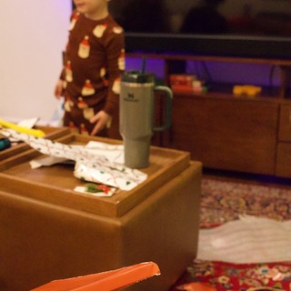 Christmas Morning Unwrapping in Cozy Living Room