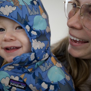 Joyful Winter Moment: Mother and Child in Blue Patagonia
