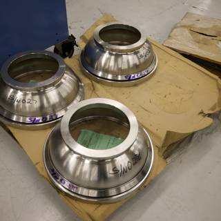 Trio of Steel Cooking Pots on Pallet