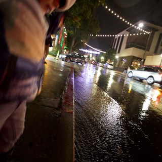 Rainy Night Street Scene with String Lights