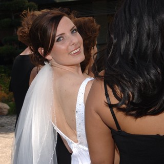 Radiant Bride Glances Back at Wedding Celebration