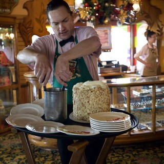 Pastry Chef Preparing Almond-Crusted Dessert at Holiday Station
