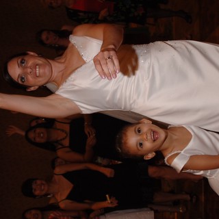 Bride and Flower Girl Celebrate on the Dance Floor