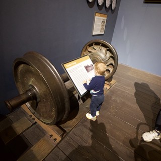 Young Child Explores Interactive Museum Display