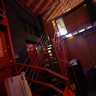 Red Steel Staircase in a Dark Music Venue