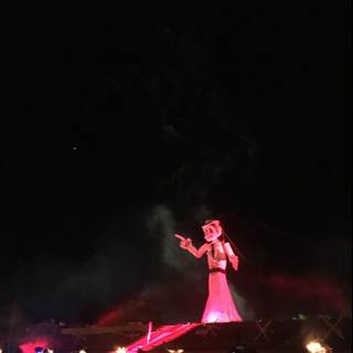 Illuminated Red Sculpture Lights Up Concert Crowd