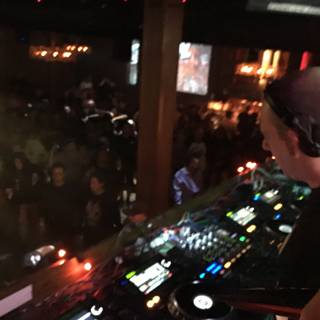 Nightclub DJ Performs for Enthusiastic Crowd