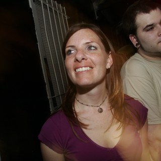 Smiling Woman at Nighttime Outdoor Gathering 2006