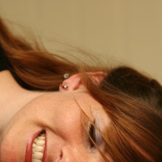 Joyful Portrait of Young Woman with Auburn Hair