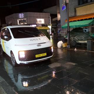 Rainy Night in Korea: White Van on a Wet Street