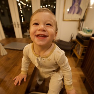 Joyful Toddler's Delighted Expression at Home