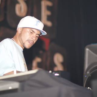 DJ Craze Spins Beats in a White Baseball Cap