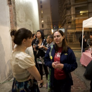 Nighttime Wine Party Gathering in Urban Alleyway