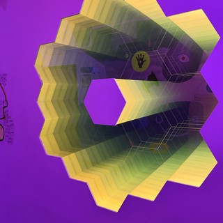 Surreal Hexagonal Tunnel Digital Art with Purple Background