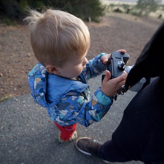 Curious Toddler Discovers Dad's Camera Outdoors