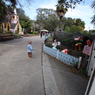 Child Exploring Whimsical Storybook Village Path