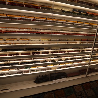 Extensive Model Train Collection Display Wall with Illuminated Shelving