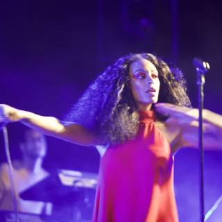 Solange Shines in Red on Stage