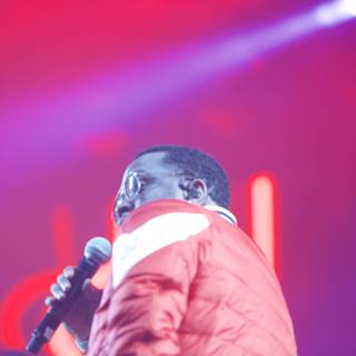 Red Jacketed Man on Stage