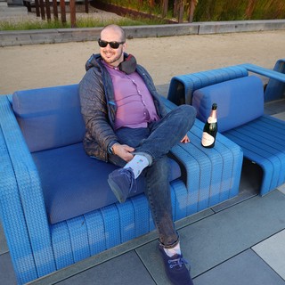 Relaxing on Blue Outdoor Furniture with Champagne