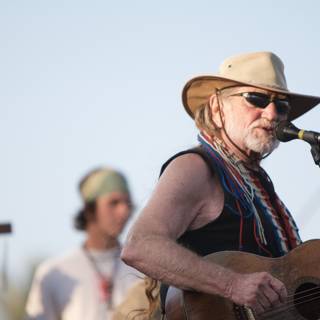 Willie Nelson's Iconic Cowboy Hat Shines Under Blue Skies at Okeechobee Music and Arts Festival