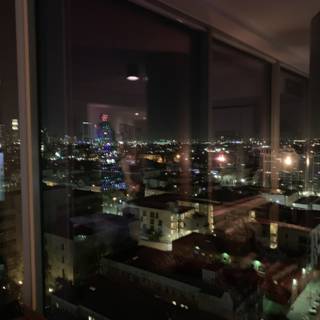 City Nightscape from High-Rise Window