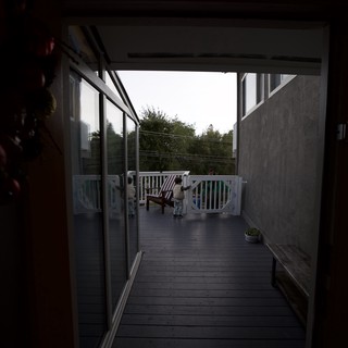 Evening View Through Open Door to Covered Deck