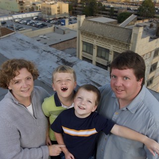 Family Portrait on Urban Rooftop at Dusk