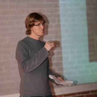 Robin Laing giving a lecture on stage