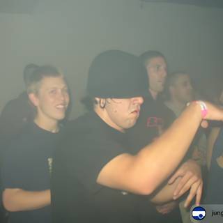 Nightclub Group Shot with Hat Guy