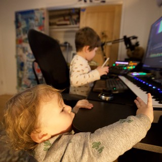 Young Brothers Making Music Together at Home