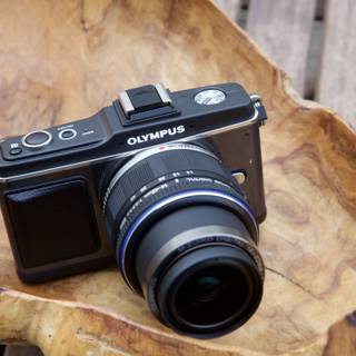 Olympus OM-D EM-5 Camera on Plywood Surface