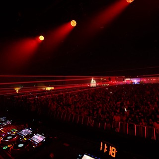 Massive Crowd Electrified by Red Laser Light Show